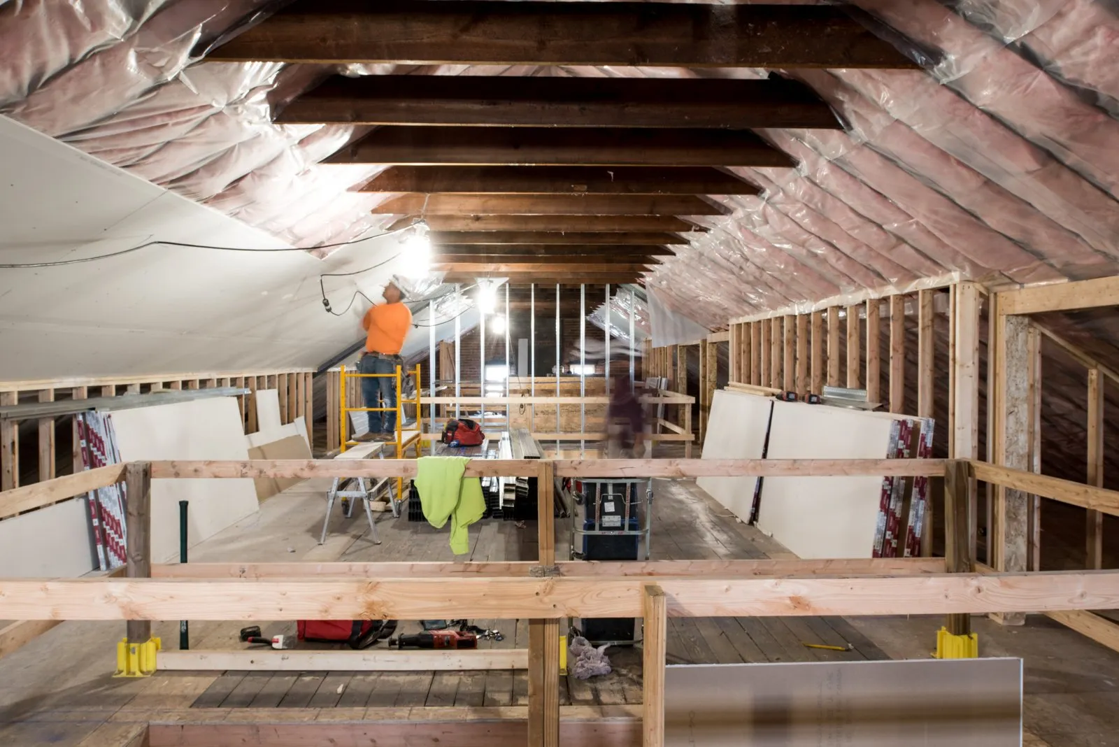 Historic building interior under renovation with exposed brick and timber