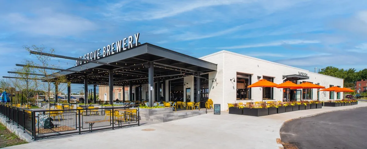 Big Grove Brewery taproom interior with timber beams and an open bar, Des Moines