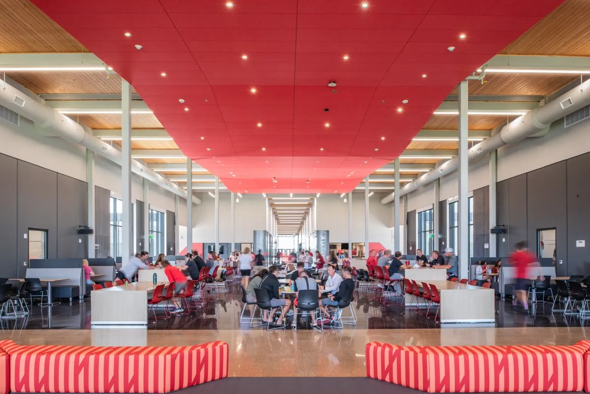 Cedar Falls High School cafeteria with red ceiling baffles