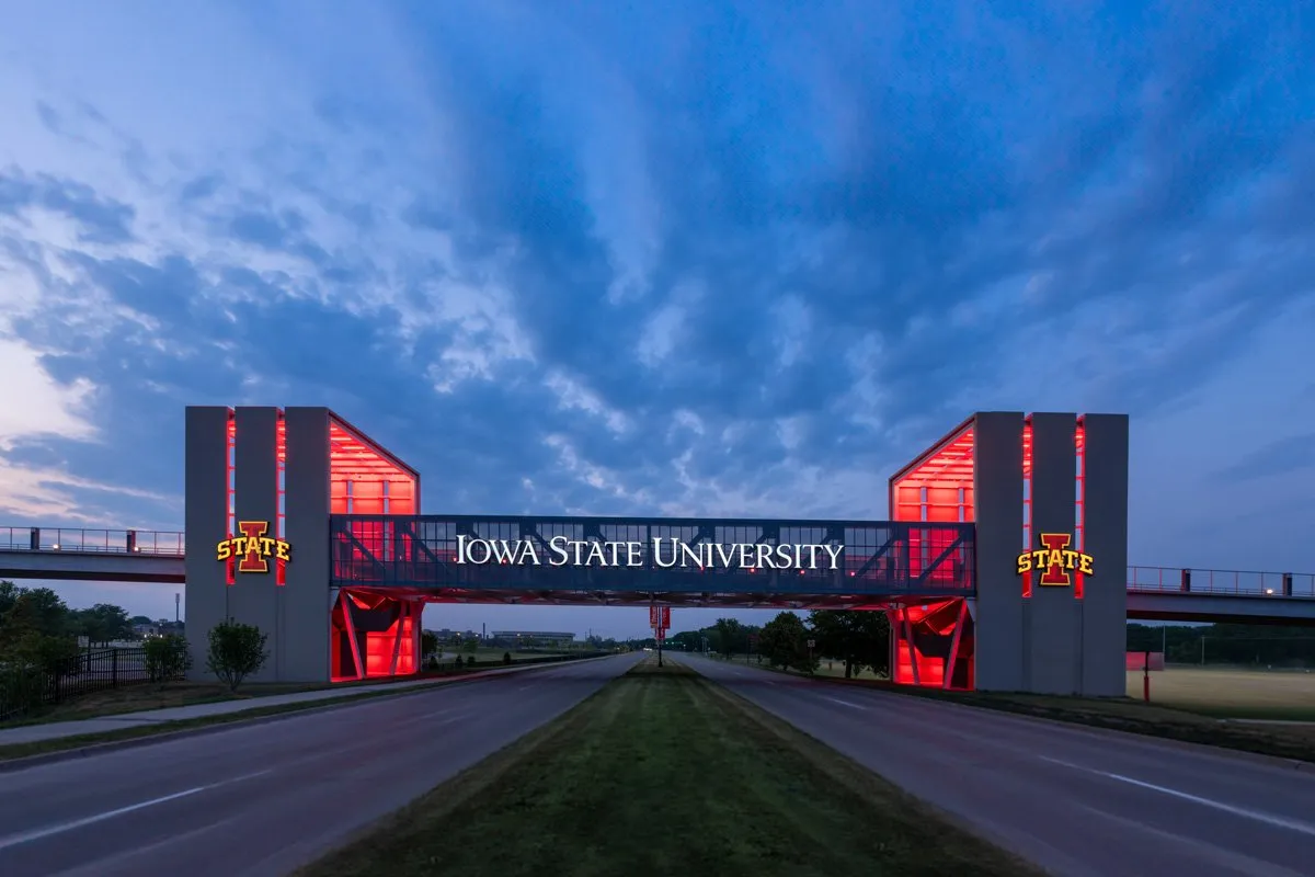 Iowa State University Gateway Bridge glowing red at dusk, Ames, Iowa