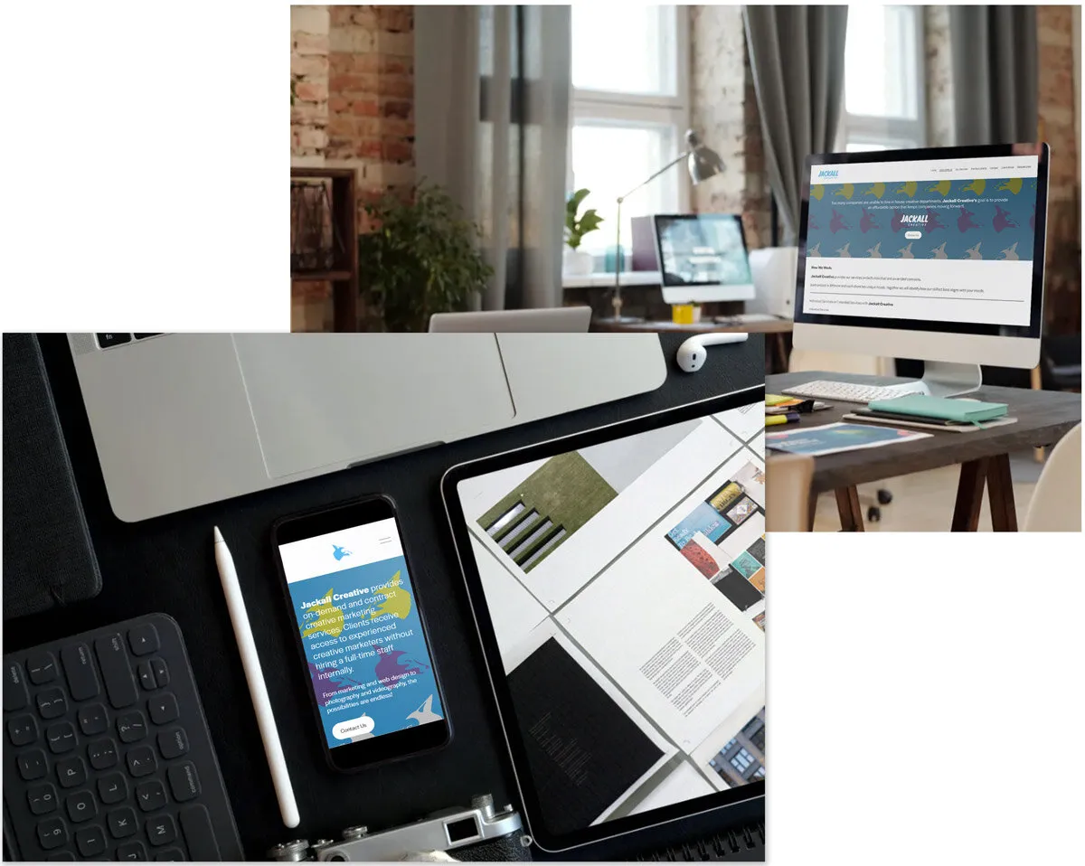 Laptop, phone and printed brand materials on a designer’s desk