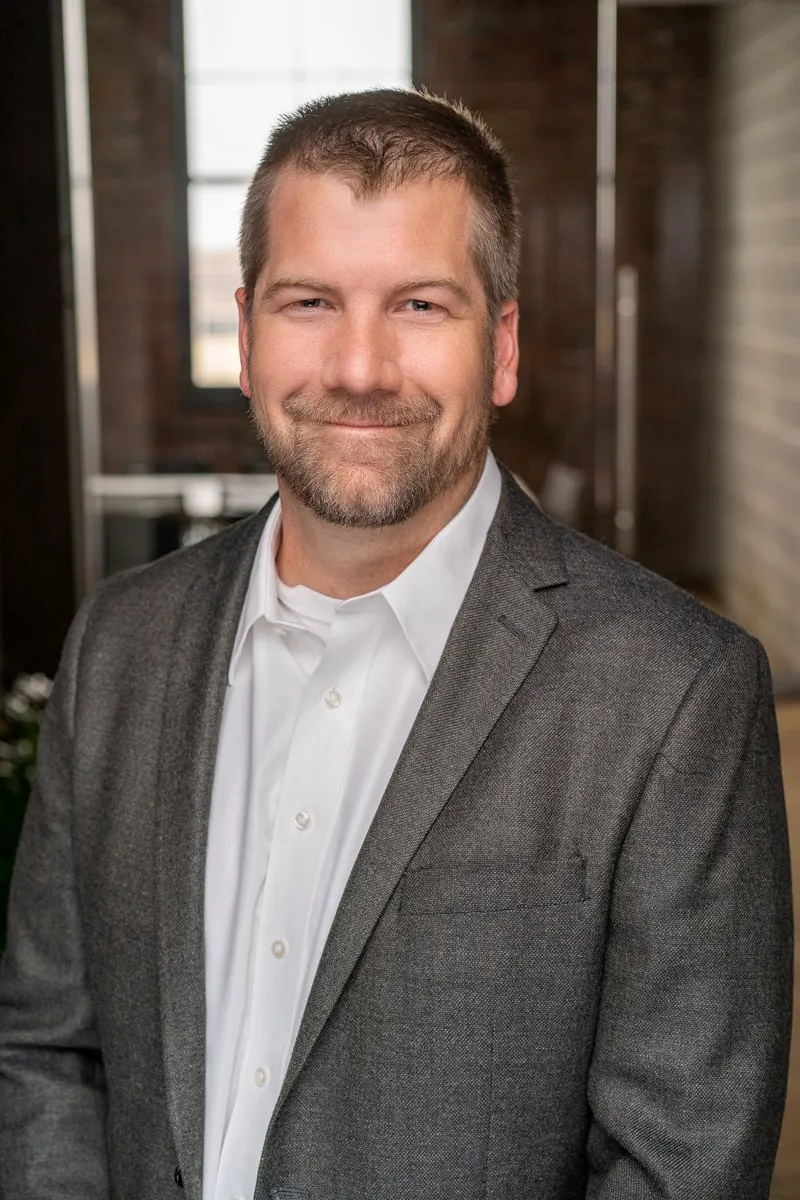 Professional headshot of J. Nielsen of MODUS