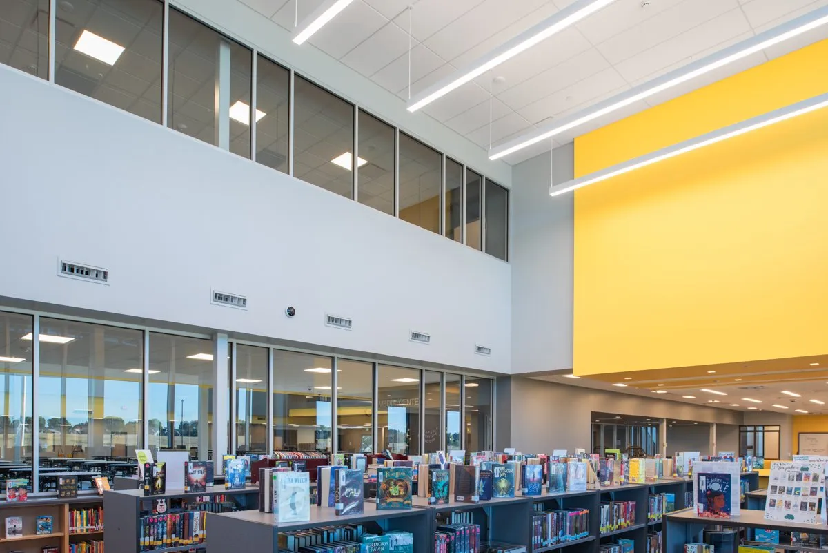 Middle school media center with a yellow accent wall