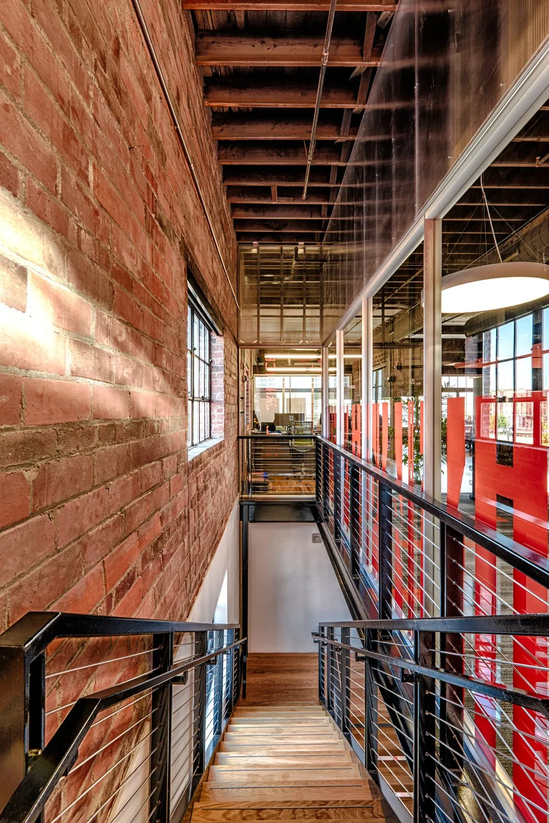 Exposed brick stairwell inside the Forge building