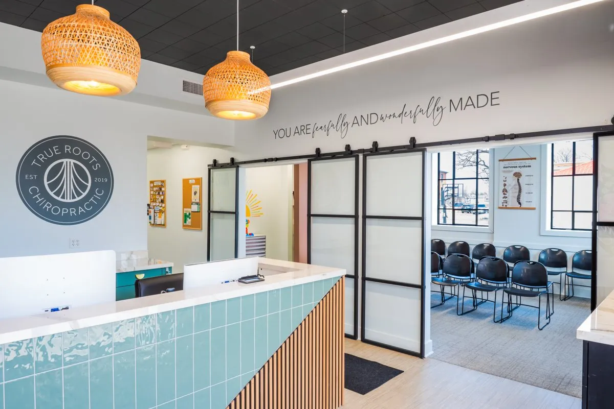 True Roots reception desk with pendant lighting