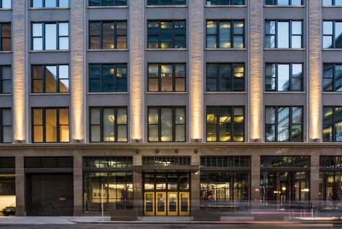 The Wilkins Building street-level facade at night, Des Moines